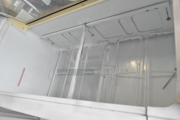 Kelvinator metal commercial ice cream dipping cabinet, interior view, shows glass panel cracks. 115 volts, 1 phase.