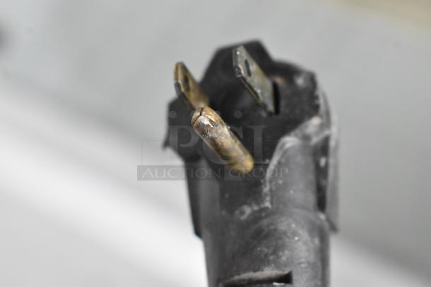 Close-up of a power plug for a Kelvinator commercial ice cream dipping cabinet. 115 volts, 1 phase.