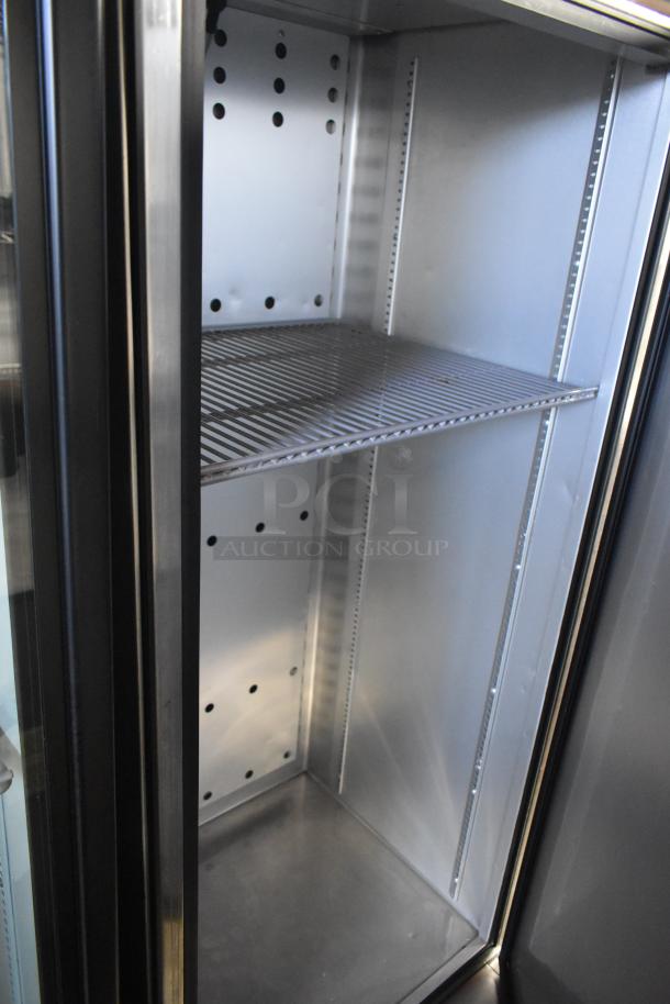 2018 True GDM-12-HC stainless steel cooler, single door, features poly coated racks. 115 volts, 1 phase. Clean interior.