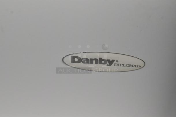 Danby DCF100A6WM chest freezer label, showing brand logo "Danby Diplomat." Electricity specs: 115 Volts, 1 Phase.