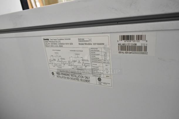 Danby DCF100A6WM chest freezer label showing specs: 115V, 1 phase, barcode, circuit diagram, model/serial number.