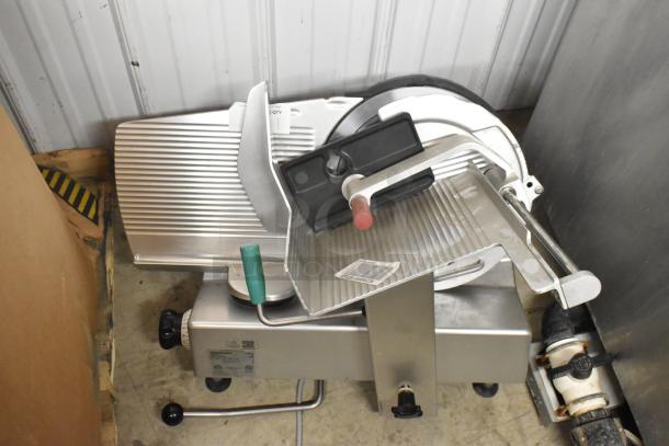 Bizerba commercial metal countertop meat slicer, used condition, 120 volts, 1 phase, with visible adjustment knobs and blade.