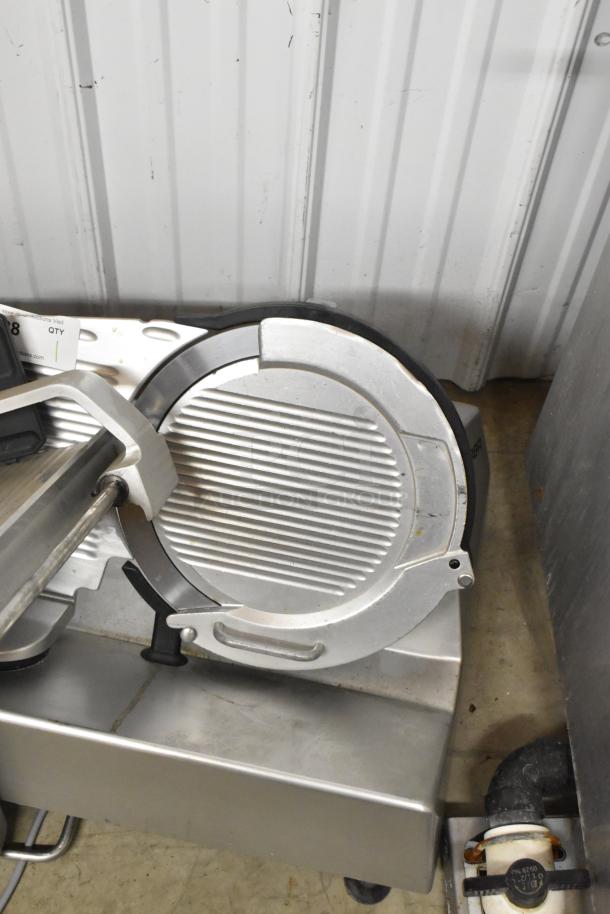 Bizerba metal commercial countertop meat slicer, 120 volts, 1 phase, in good condition. Features sturdy build and sharp blade.