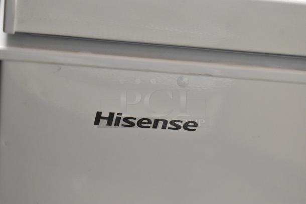 Hisense WFC050M6XWD chest freezer, white exterior, brand logo visible, 115 volts, 1 phase, sleek design.