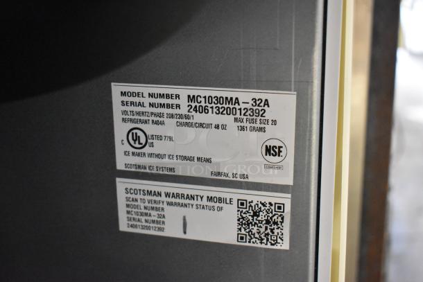 2024 Scotsman MC1030MA-32A ice machine, stainless steel, 1077 lb capacity, 208/230V, 1 phase. Labels show model and serial numbers.
