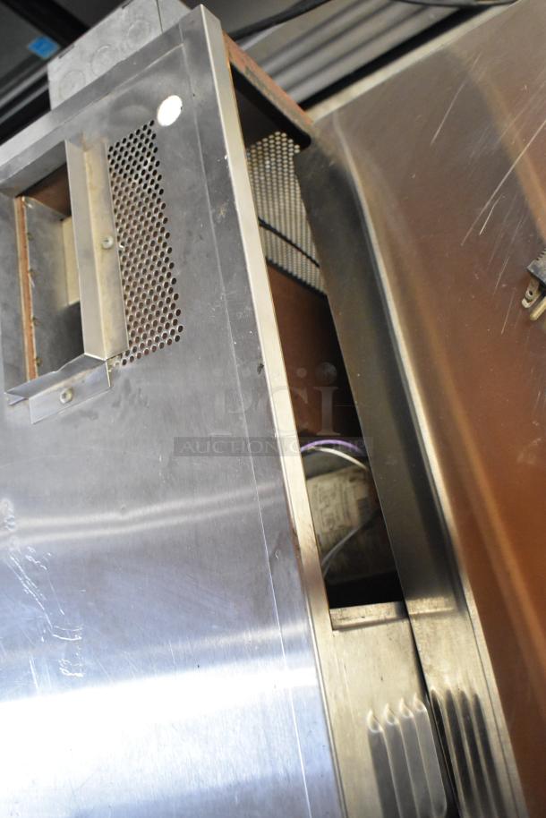 Blodgett stainless steel gas convection oven, half-size, features view-through door, metal racks, thermostatic controls.