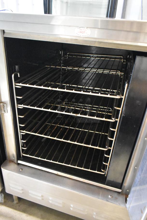 Blodgett stainless steel gas convection oven, half-size, view-through door, metal racks, thermostatic controls, excellent condition.