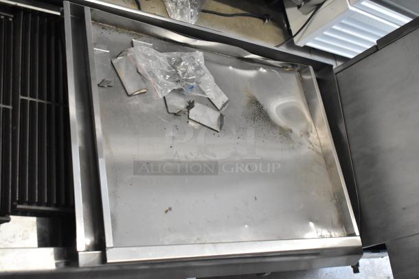2022 Cooking Performance Group 351CRCPG72NL 72" stainless steel natural gas charbroiler, 240,000 BTU, used, with surface wear.