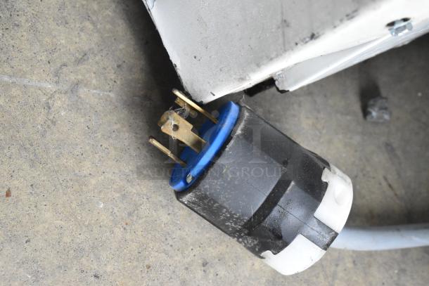Close-up of a power plug for a Desmon GBF-15-ETL commercial blast chiller. Shows 3-phase connectivity details.