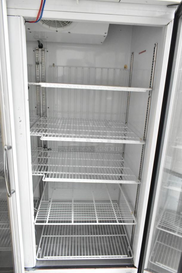 Turbo Air TGF-49F commercial freezer, 2-door, metal, poly coated racks, 115V, 1-phase, like-new condition.