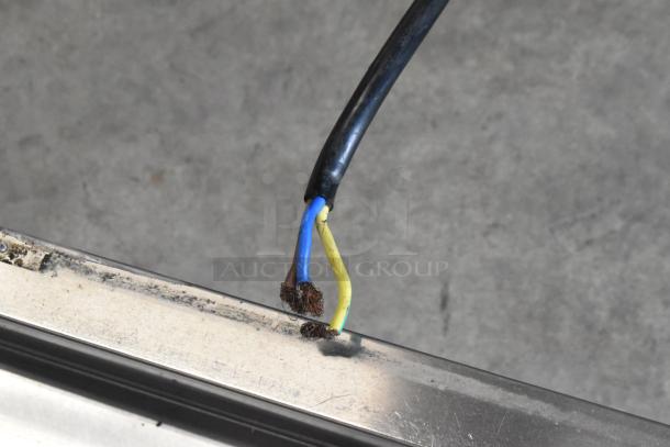 Damaged power cord on BQ333 soft serve ice cream machine, revealing exposed wires. Requires repair before use.