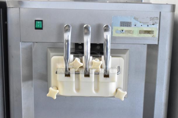 BQ333 stainless steel commercial ice cream machine with 2 flavor twist function, 110V, 1 phase, on casters, good condition.