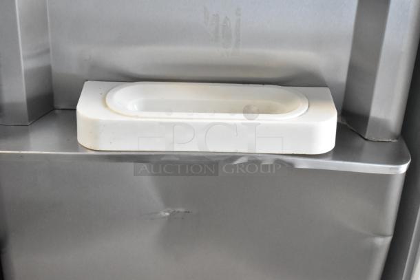 Stainless steel BQ333 soft serve ice cream machine, 2 flavor with twist, on commercial casters, 110V, 1 phase. Visible wear.