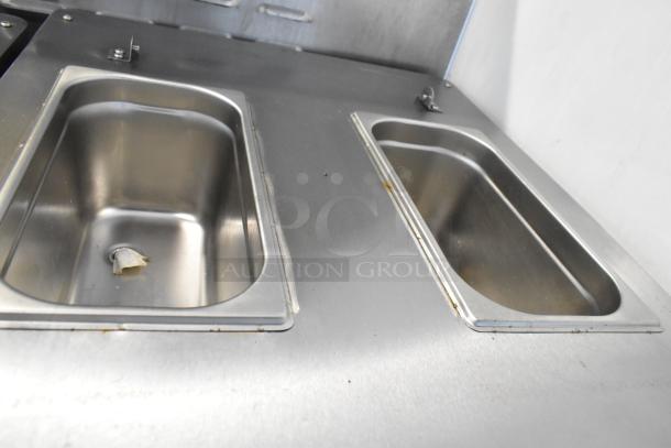 BQ333 Stainless Steel Soft Serve Ice Cream Machine, dual-flavor with twist, on casters. 110V, 1 Phase, clean interior.
