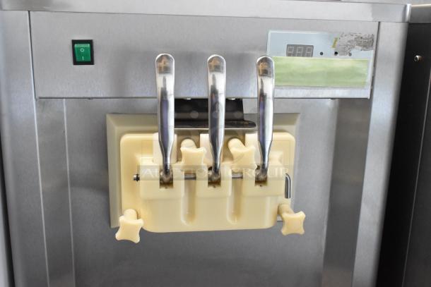 BQ333 Stainless steel ice cream machine, 2 flavors, twist, commercial casters, 110V, 1 phase. Control panel visible.