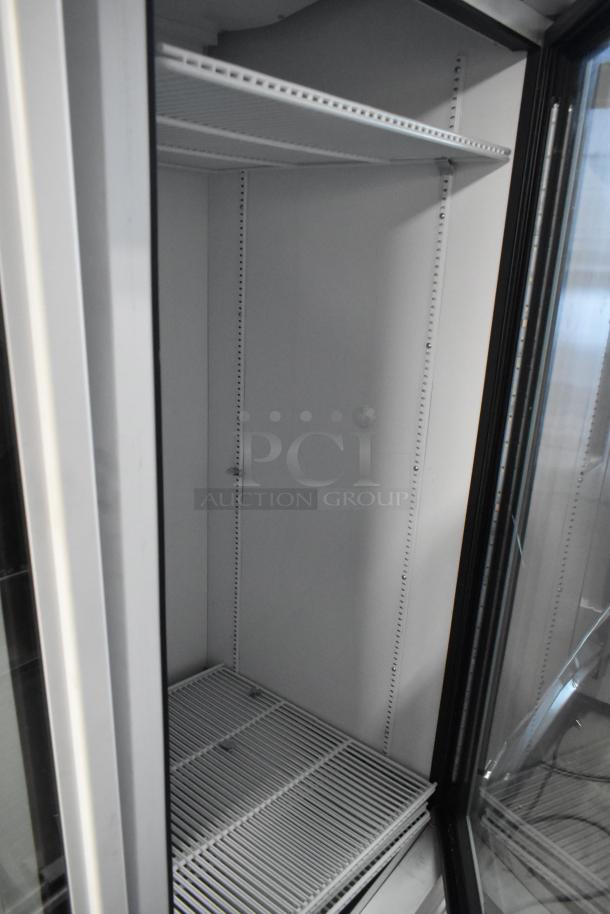 2021 True TSCI-600R-G-PH commercial reach-in cooler, single glass door, poly-coated racks, 115V, excellent condition.
