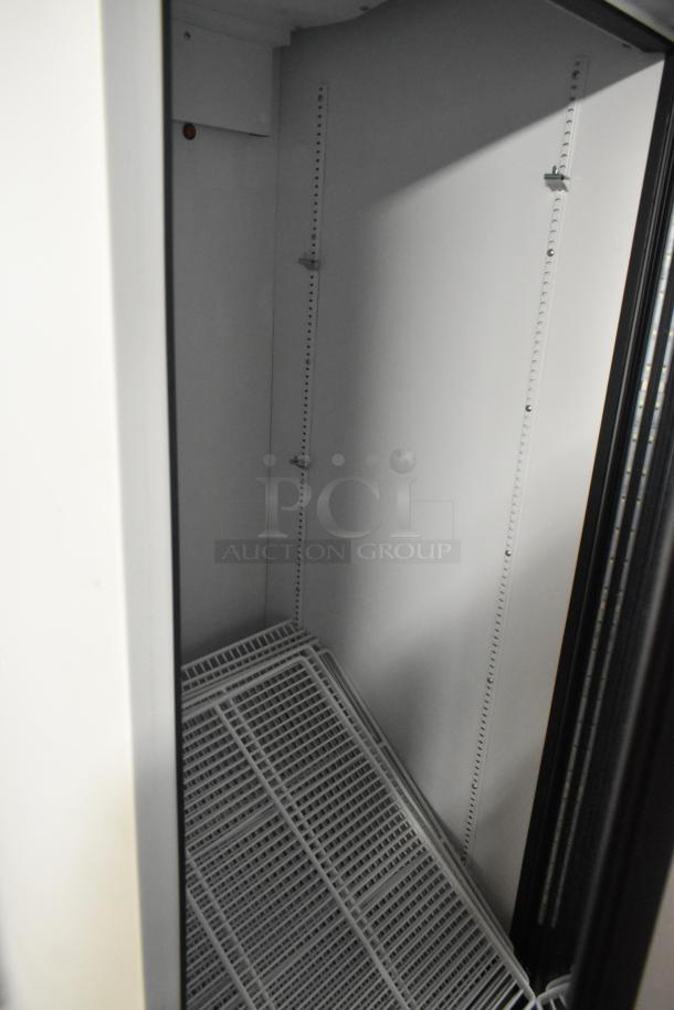 2021 True TSCI-600R-G-PH commercial cooler, single door, poly coated racks, metal interior, 115V, excellent condition.