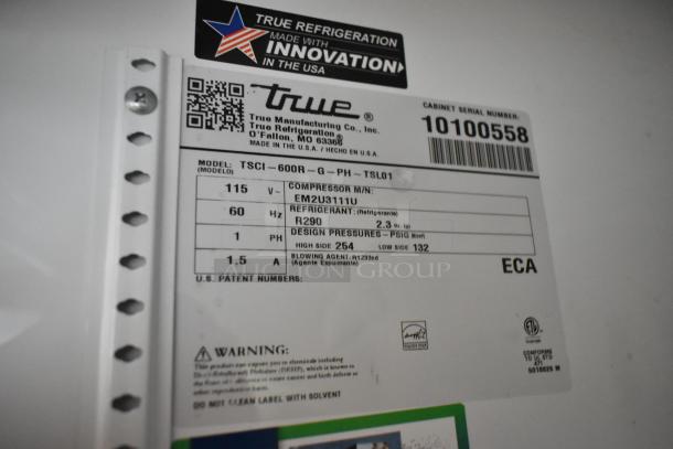 2021 True TSCI-600R-G-PH single-door cooler, metal, poly-coated racks. 115V, 1 Phase. Model, voltage, and refrigerant info on label.