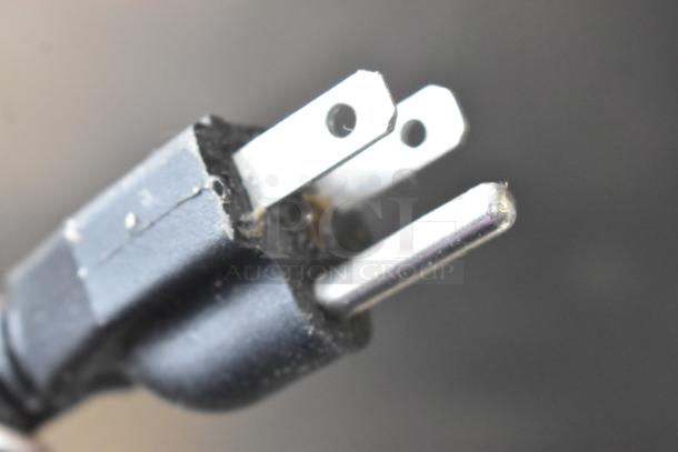 Close-up of a 3-prong electrical plug for the Estella 348SM30 30 Quart Spiral Dough Mixer, 120V, used condition.