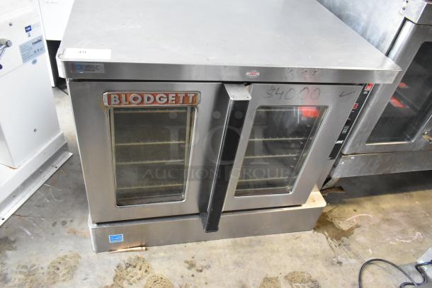 Blodgett stainless steel commercial convection oven with view-through doors, oven racks, and thermostatic controls.