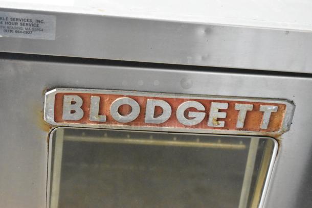 Blodgett stainless steel commercial convection oven with view-through doors, oven racks, and thermostatic controls.