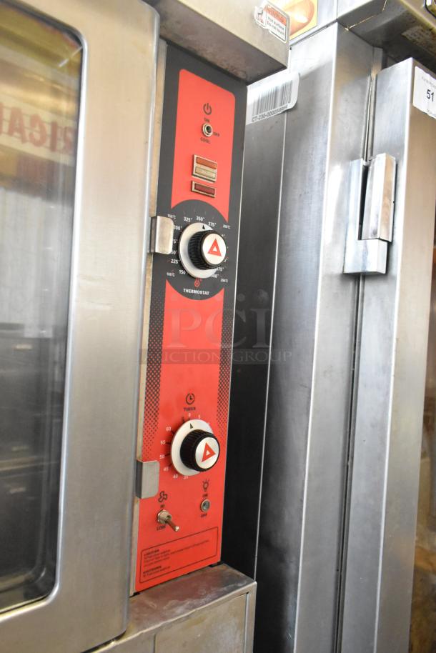 Stainless steel convection oven with view-through doors, thermostatic controls, and commercial casters.
