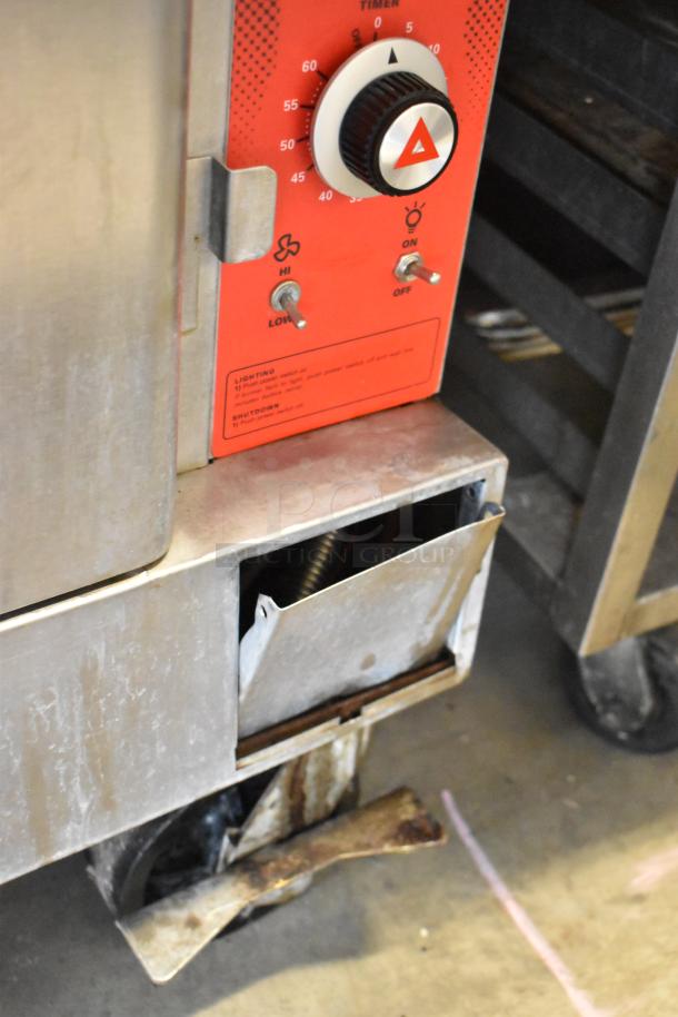 2 stainless steel full-size convection ovens with view-through doors, thermostatic controls, on commercial casters.