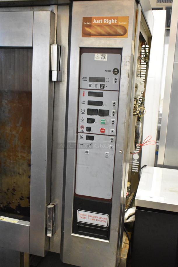 Baxter stainless steel mini rotating rack oven with control panel, double pan rack, and visible circuit breaker label.