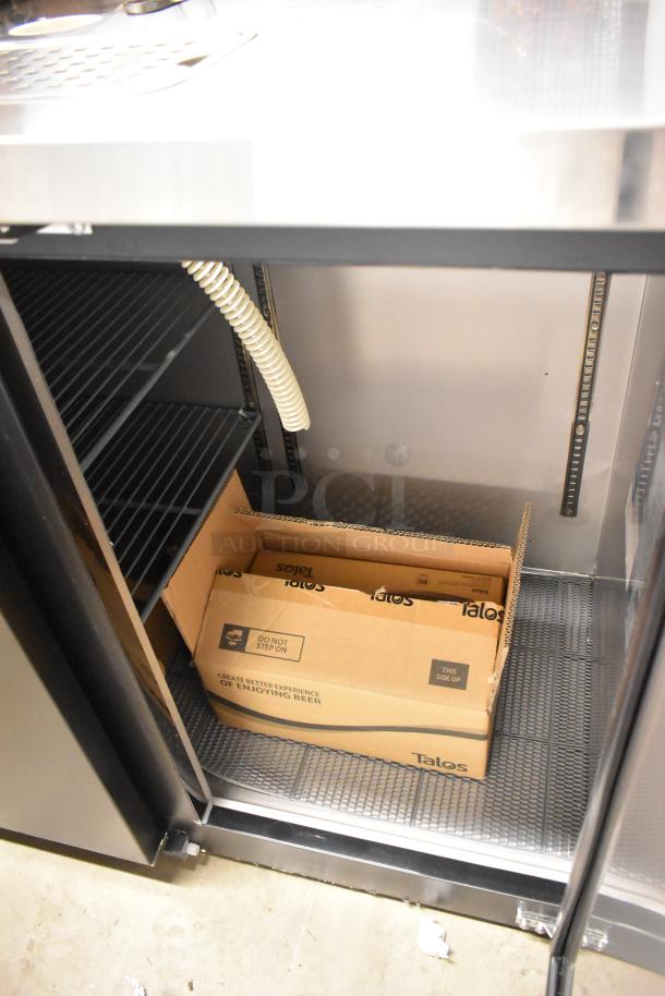 Brand new Avantco 178UDD72HC kegerator, black metal, double tap. Visible interior with shelf, coil, and Talos box.
