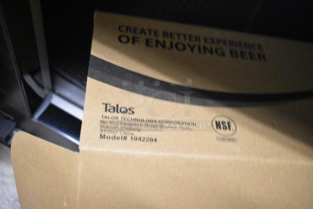 Box showing NSF certification for Talos Technology Corporation, Model #1042204. Partial view of enclosed item.