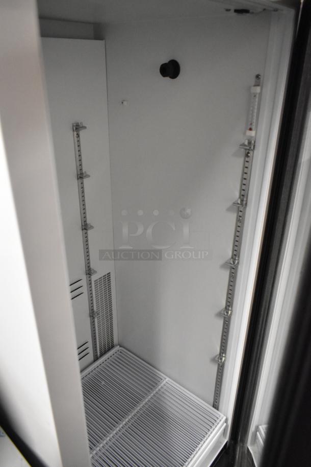 Habco SE12HC single door cooler merchandiser, poly coated racks, metal interior, 115V, 1 phase, excellent condition.