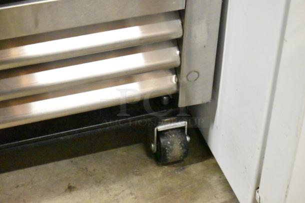 2023 True T-19F-HC stainless steel freezer on commercial casters. Features durable poly-coated racks. 115V, 1 phase.