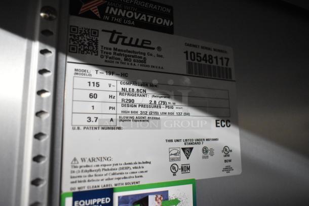 2023 True T-19F-HC commercial freezer label showing model, voltage, refrigerant, and certifications.