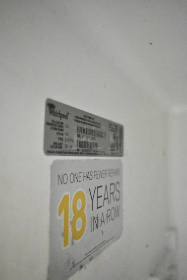 Whirlpool WRT51SZDW05 reach-in cooler with freezer, 115V, 1 phase. Visible label and "18 years in a row" sticker.