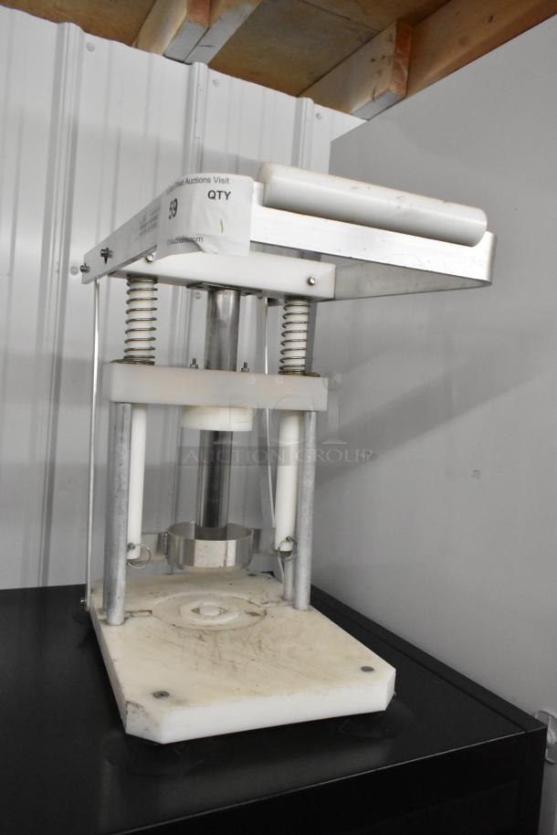 Metal countertop pineapple corer with sturdy springs. Shows mild wear. Auction label on top indicates item number 59.