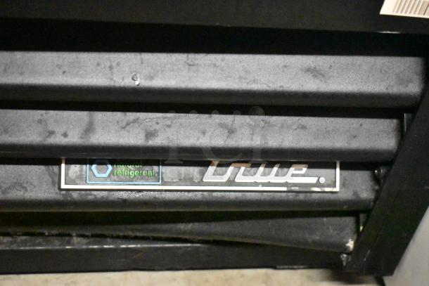 2018 True GDM-41SL-48-HC-LD commercial cooler label, natural refrigerant usage noted, black metal exterior.