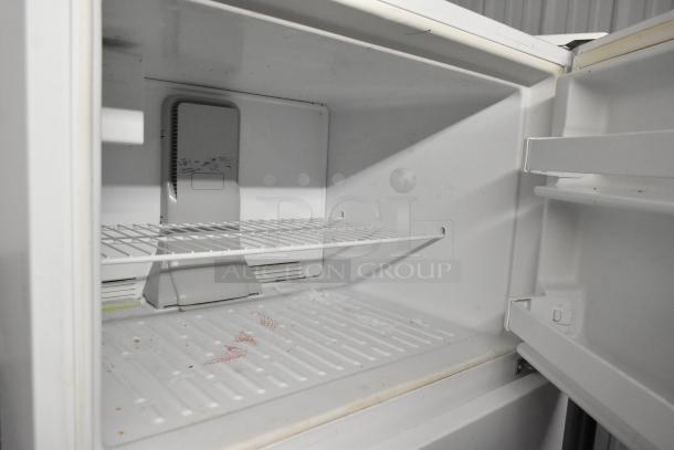 Maytag M1TXEGMYW01 reach-in cooler with freezer, 115V, 1 phase. Interior view, wire shelf, clean condition.