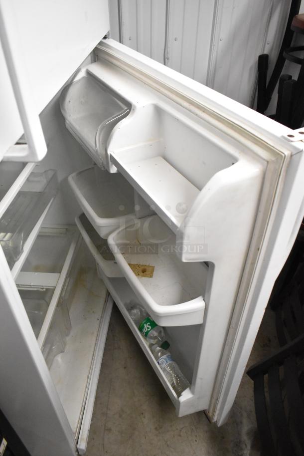 Maytag M1TXEGMYW01 reach-in cooler with freezer, 115 volts, 1 phase. Interior shelves and door bins visible. Used condition.