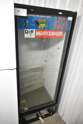 True GDM-12 metal commercial single-door cooler, 115V, 1-phase, with DMF Bait Co. signage, used condition.