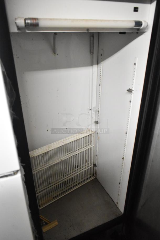 True GDM-12 commercial single door cooler, used condition, metal interior, 115 volts, 1 phase, shelf included.