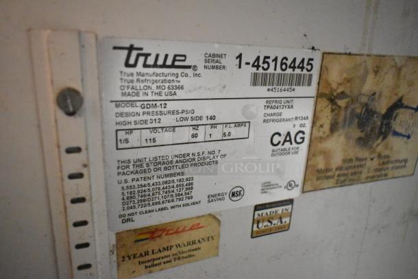 True GDM-12 cooler tag, showing model, 115V, 1 phase, NSF listed. Made in USA, 2-year lamp warranty. Serial 1-4516445.