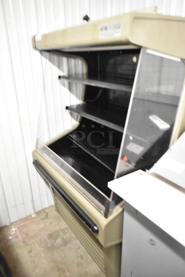 Hussmann GSVM-4060 commercial grab n go merchandiser, metal, 115V, 1 phase, black interior, three shelves, good condition.