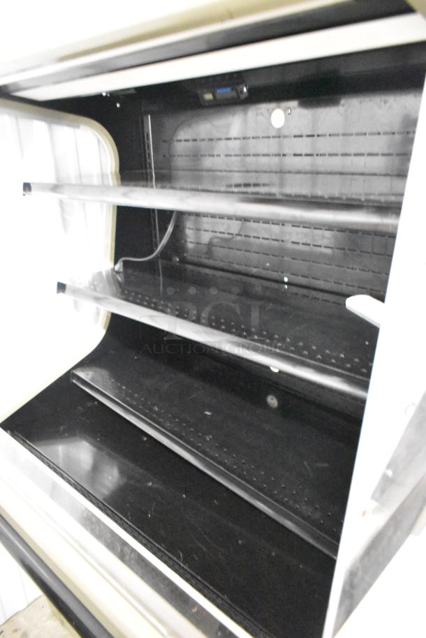 Hussmann GSVM-4060 metal grab-n-go merchandiser, black interior, 115 volts, 1 phase, with multiple shelves.