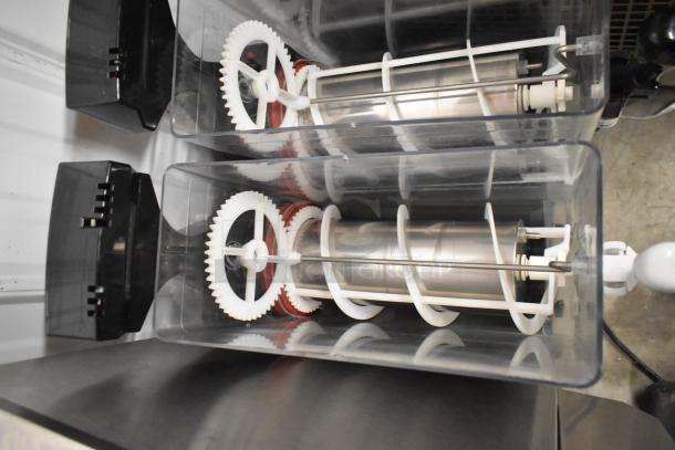 SPM Frosty 2 New stainless steel slushie machine with 2 hoppers, visible internal gears and augers. 115 Volts, 1 Phase.