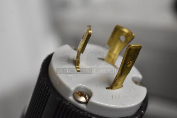 Close-up of a power plug for Vevor SS240 soft serve machine, showing 250V labeling and prongs for 220V, 1 phase connection.