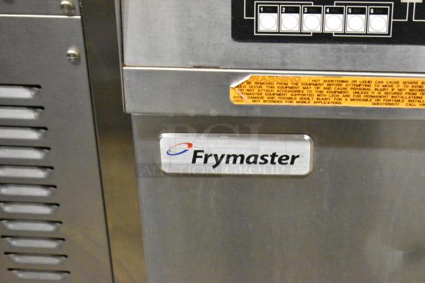 Frymaster FBCR18CSE stainless steel commercial deep fryer on casters, 90,000 BTU, natural gas powered, warning label visible.