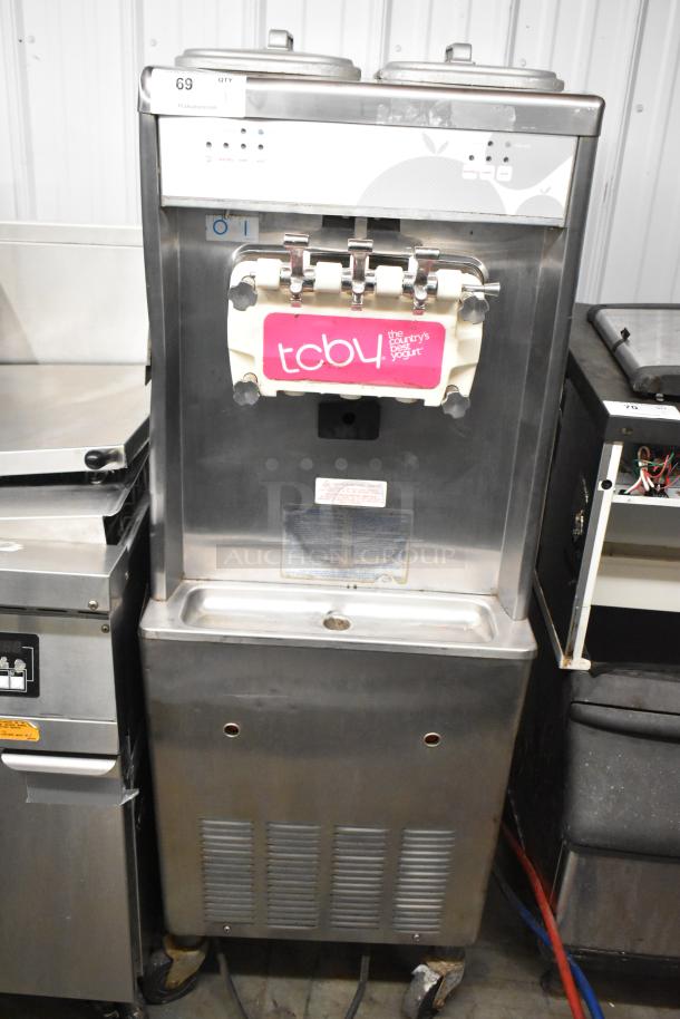 Stainless steel 2-flavor soft serve ice cream machine with twist option, on casters, 208/240V, 3-phase, commercial use.