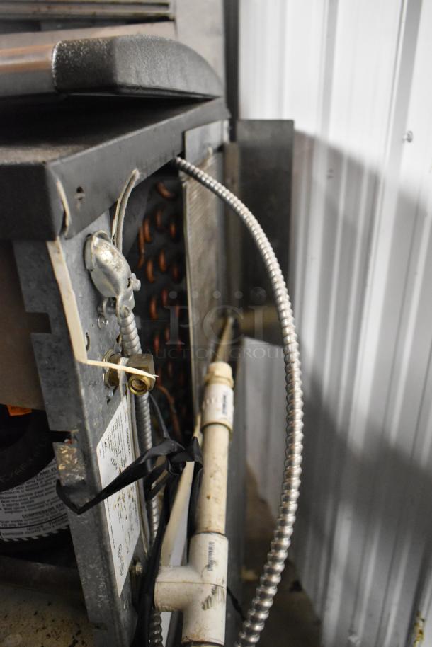 Manitowoc QD0282A ice head on S170 bin, showing rear view with electrical and plumbing connections. 115 volts, 1 phase.