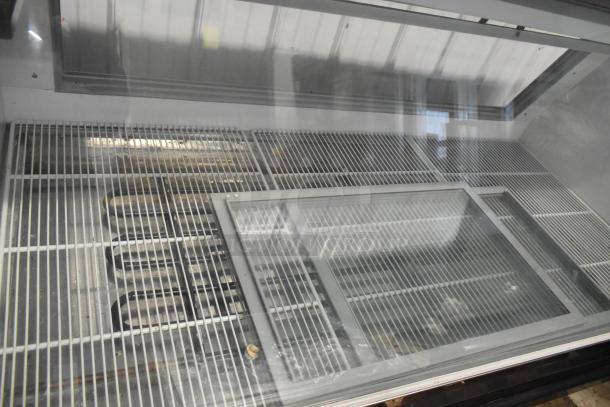McCray Metal Commercial Deli Display Case, floor style, showcases metallic grid shelves, glass top, excellent condition.