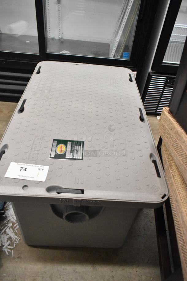 Brand new Endura 3925XTA02T grease trap, 50 lb, 25 GPM, 2" threaded connections, minor scratches. Visible labels indicate model and specifications.